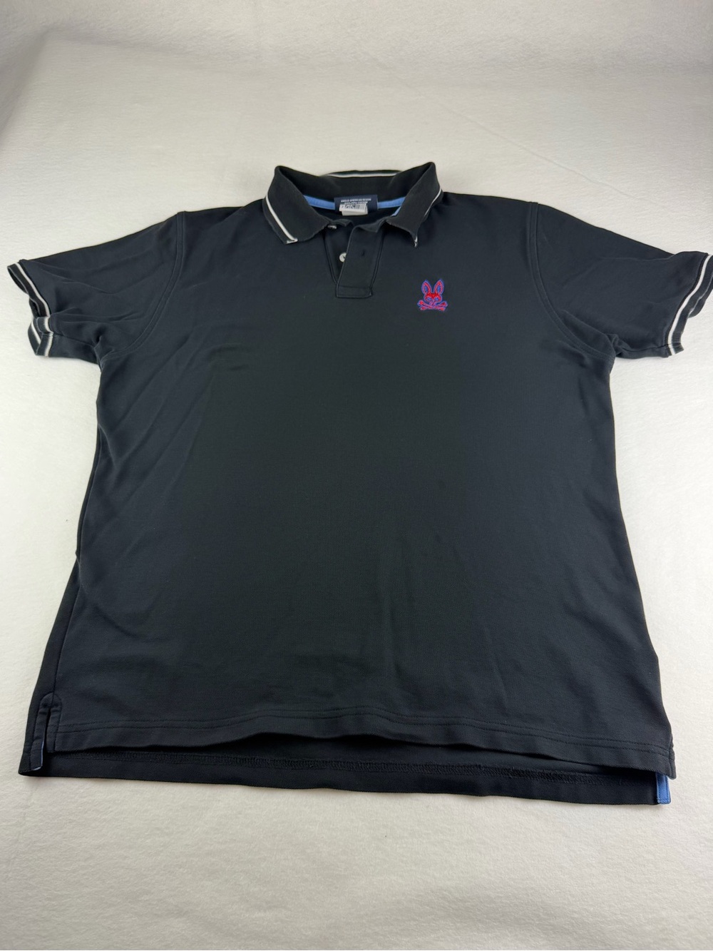 Psycho Bunny Men's Black Polo with Red and Blue Striped Collar
